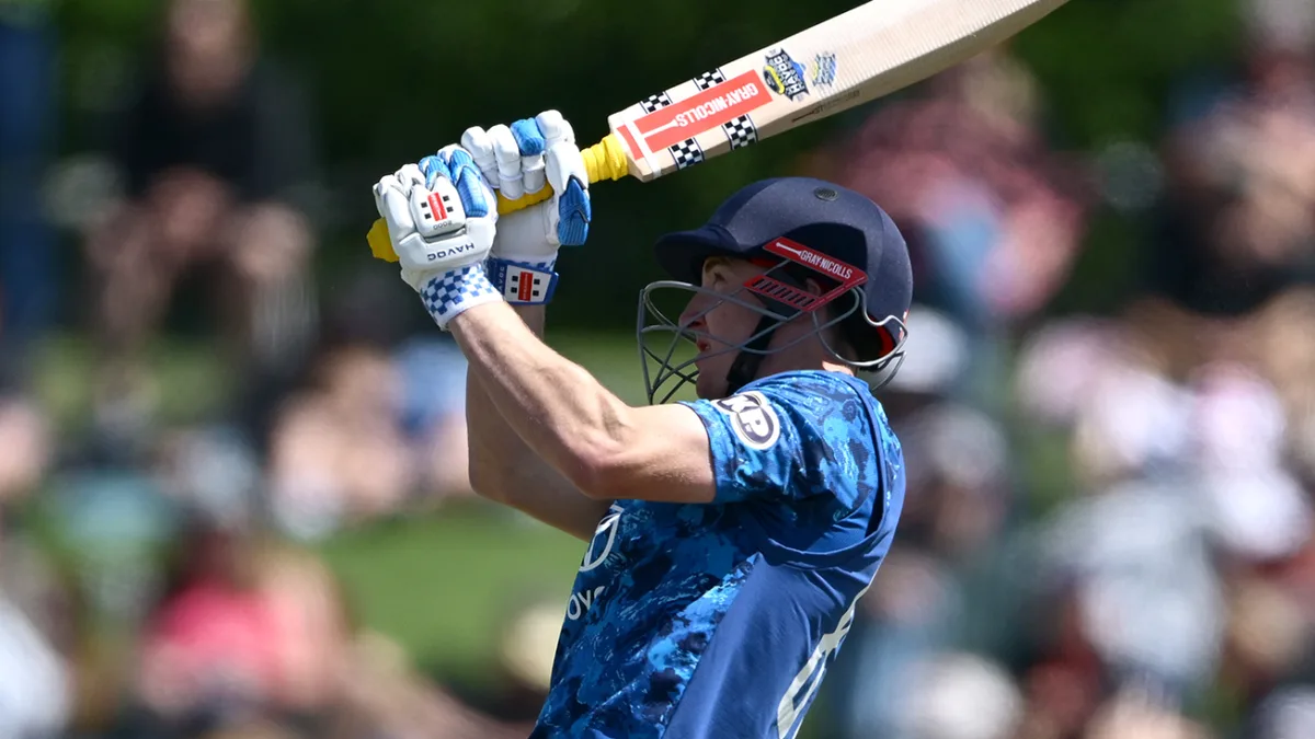 Harry Brook biography: Harry Brook batting in the England blue ODI kit, raising his bat during the NZ vs ENG 1st ODI record innings