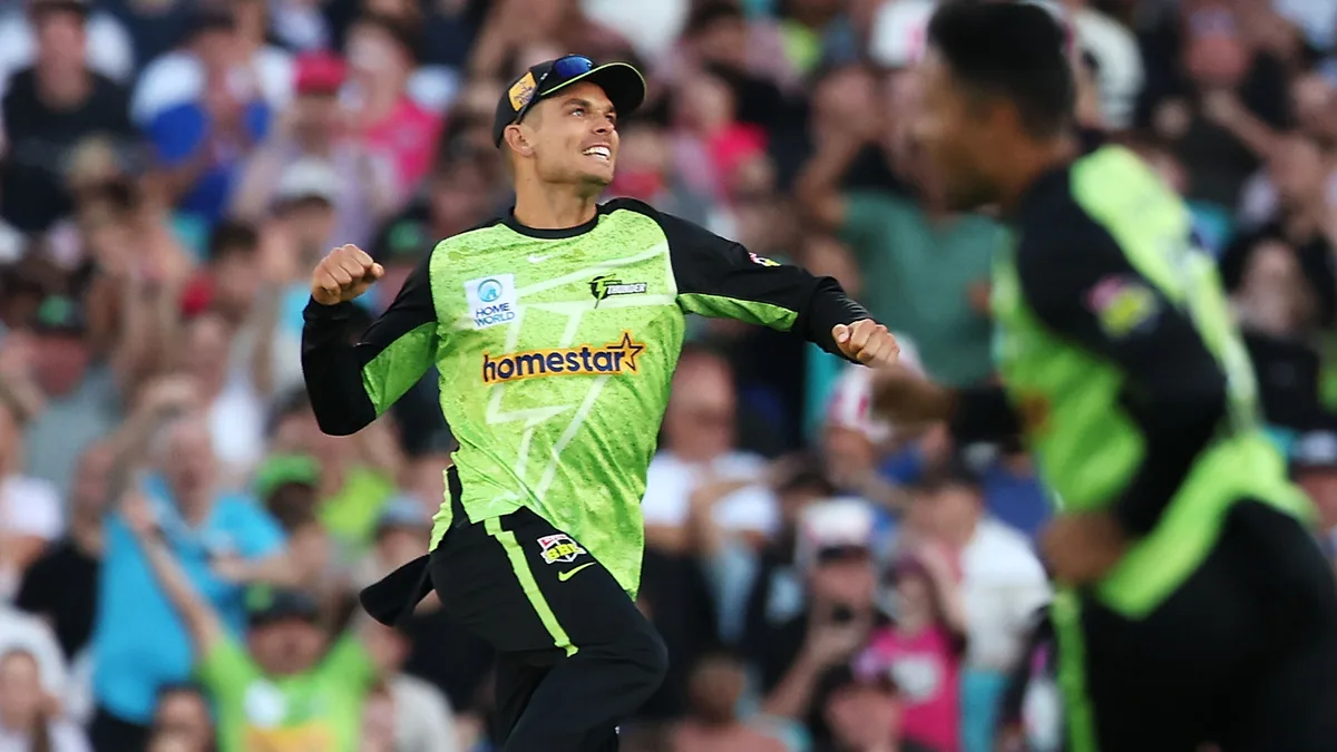 BBL signings: Sydney Thunder / Brisbane Heat: Sydney Thunder player in green-black (Homestar kit) celebrates a wicket with arms out
