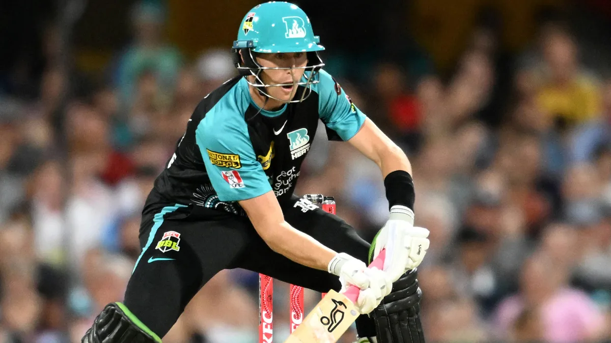 BBL signings: Sydney Thunder / Brisbane Heat: Brisbane Heat batter in teal-black (National Storage, KFC) plays a shot, helmet and gloves on