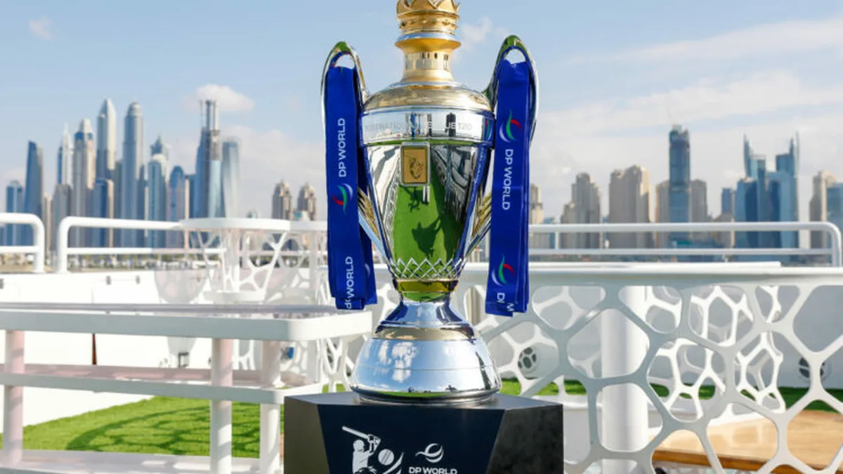 ILT20 Season 5 guide: The DP World ILT20 trophy with blue ribbons on a yacht deck against the Dubai Marina skyline