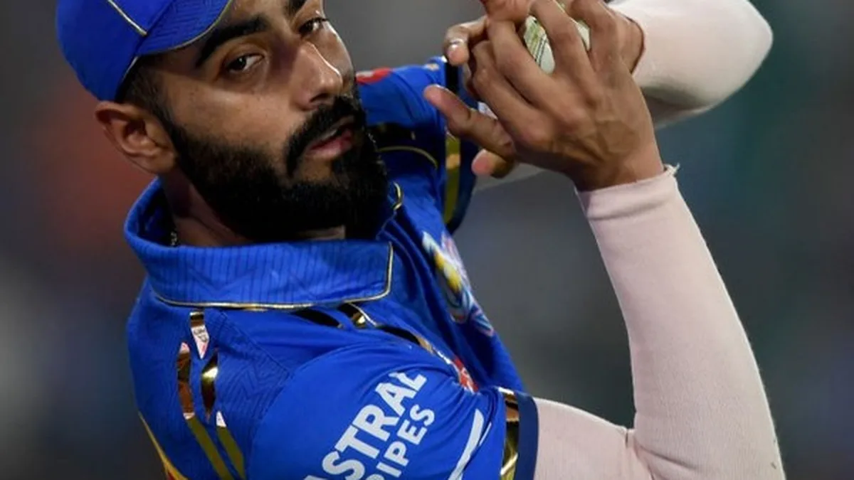 Naman Dhir biography: portrait of Naman Dhir holding the ball