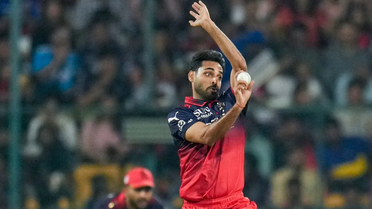 bhuvneshwar kumar biography: Bhuvneshwar Kumar bowling for RCB in IPL 2026