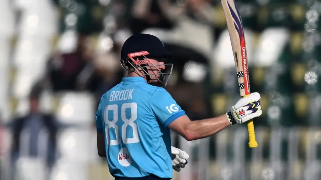 Harry Brook biography: Harry Brook at Rawalpindi seen from behind with BROOK 88 on his jersey, raising his bat after a 42-ball fifty against Sri Lanka